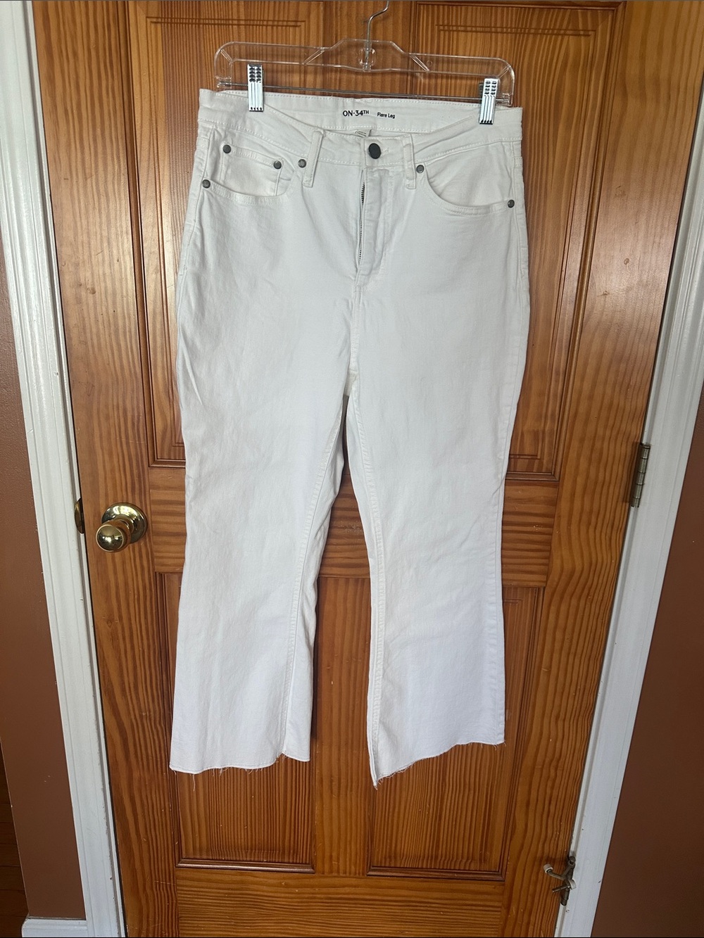 White ankle length flair jeans